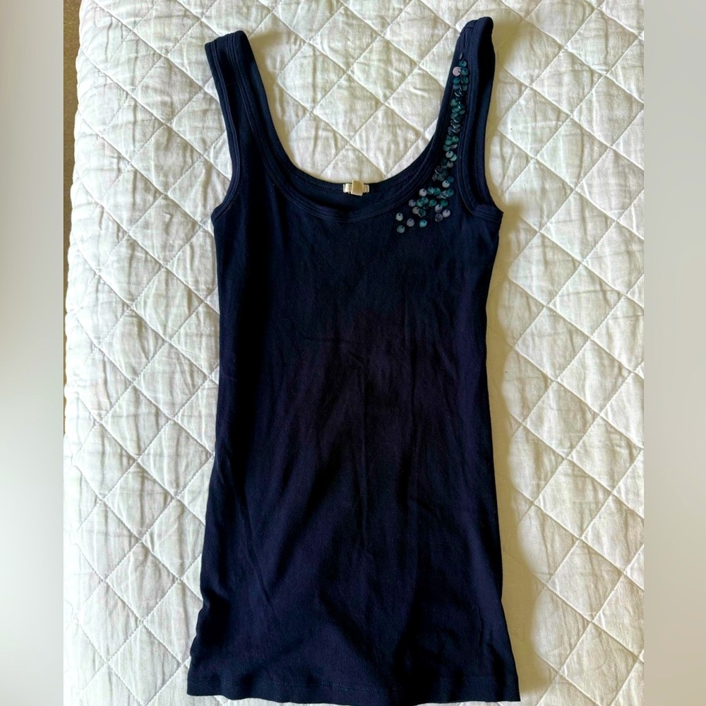 J Crew cotton tank with pearlized discs on n left strap.